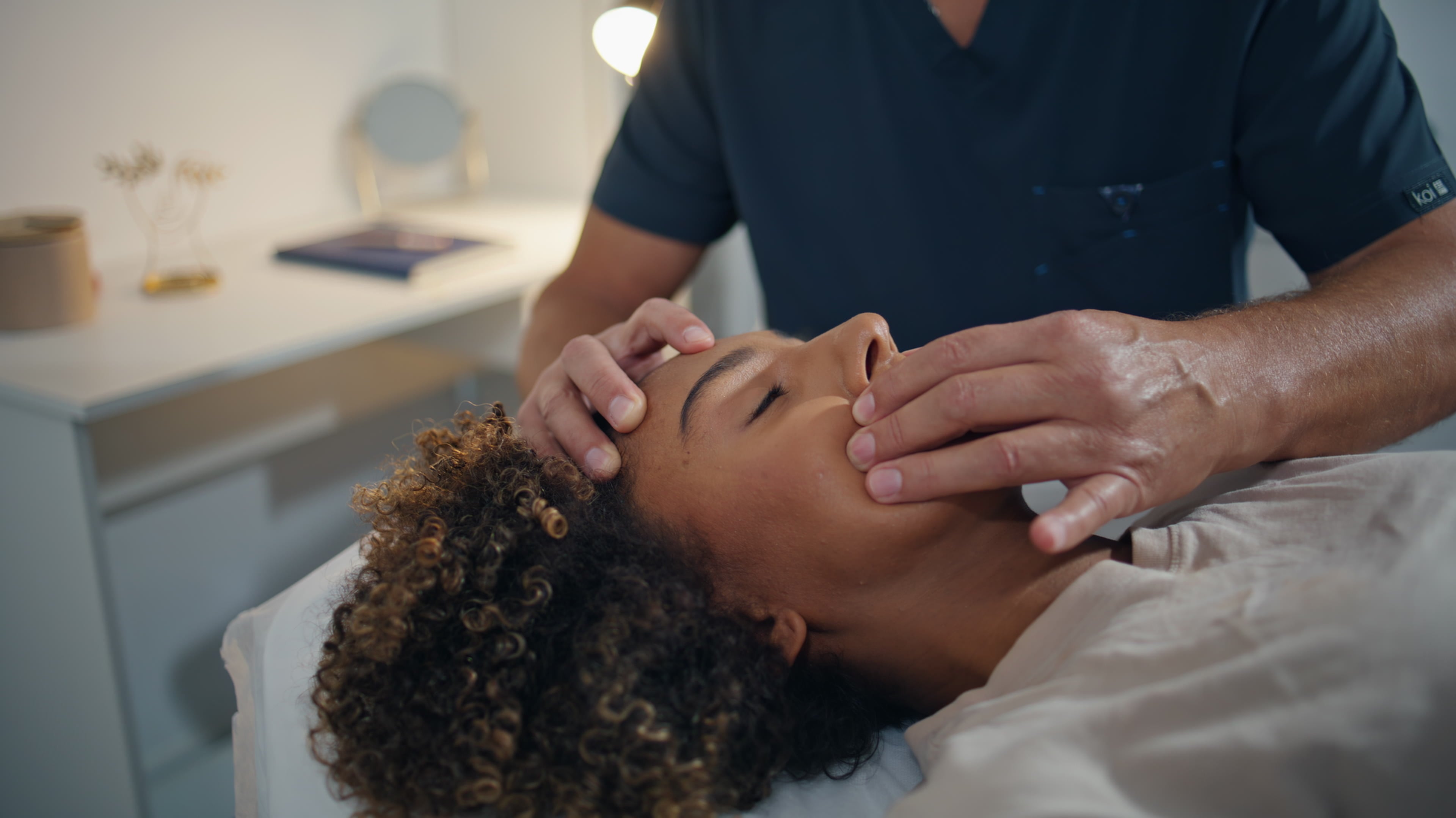 woman-lying-chiropractic-therapy-in-health-center-2024-11-05-05-53-08-utc